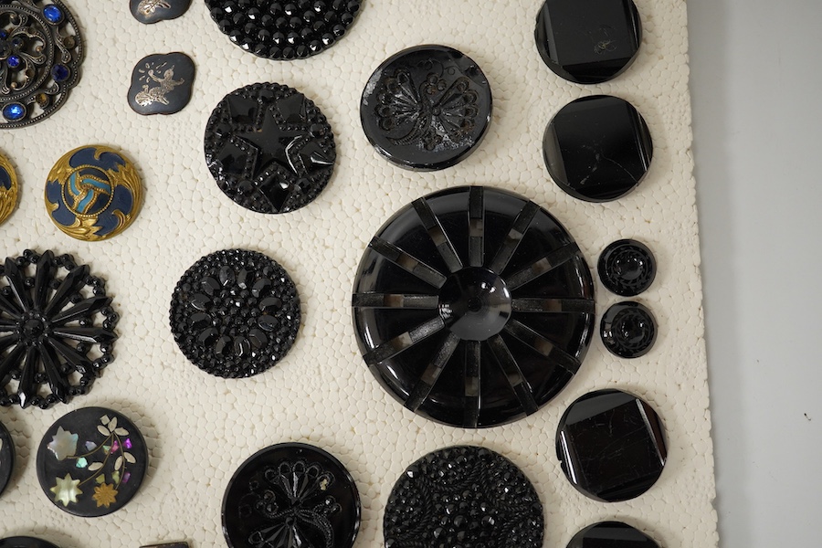 A collection of assorted Victorian and later jet, simulated jet and other decorative buttons, largest 50mm. Condition - good